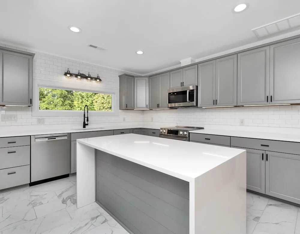 Modern kitchen with white cabinets after remodel